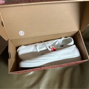 Never worn. Men’s 10.5. Womens 12. Vans Classic White Low-Top Sneakers